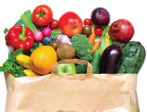 Paper shopping bag containing groceries