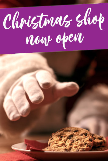 A banner saying Christmas Shop Open