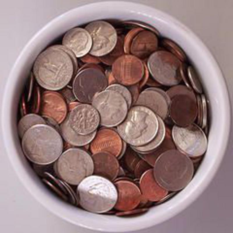 a pot of change saved by shopping at Real Foods