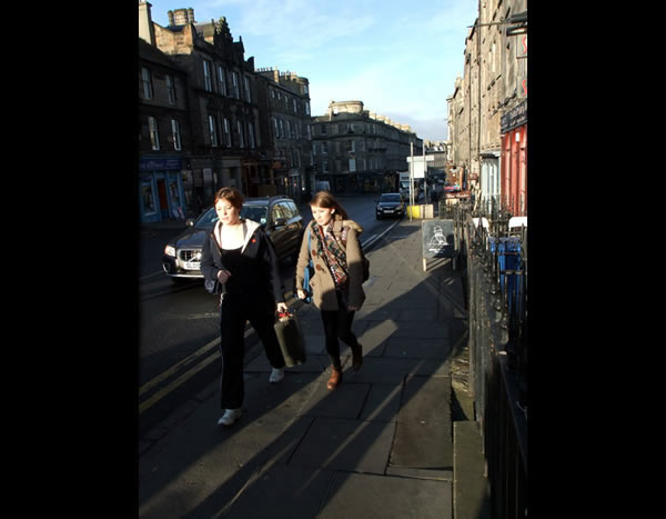 People walking up Broughton Street