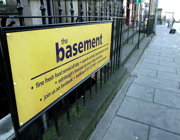 The basement restaurant sign