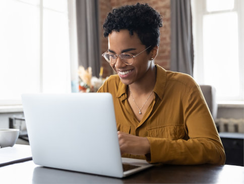 Someone reading on a laptop